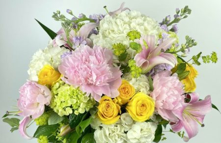 Lush hydrangea, local peonies, gorgeous roses. lilies and fragrant stock are accented with delicate buplereum
