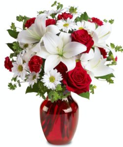 Life's best moments together are about the purity of love; and when you send this captivating Be Mine flower bouquet to someone special, you'll be showing them how much you care. With red roses for love and white lilies and daisies for purity, it's a heavenly gift for your Valentine