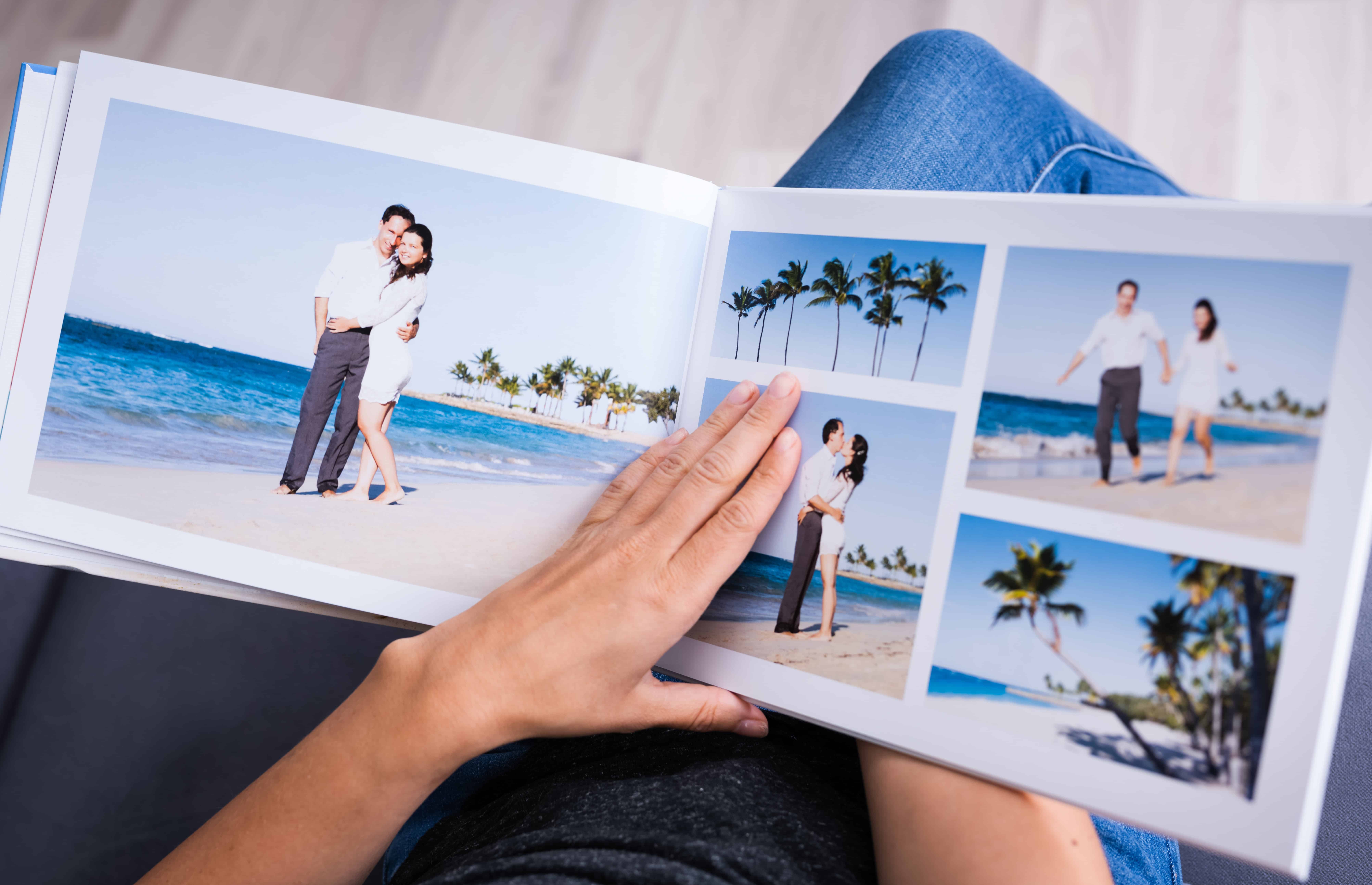 photo book open to page of couple on beach