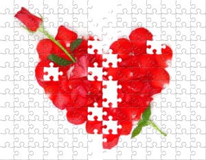 Red rose and petals in a heart jigsaw puzzle